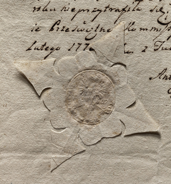 Oval seal impression of the town of Tuszyn. Crowned eagle. On the sides the date 15 67. Illegible