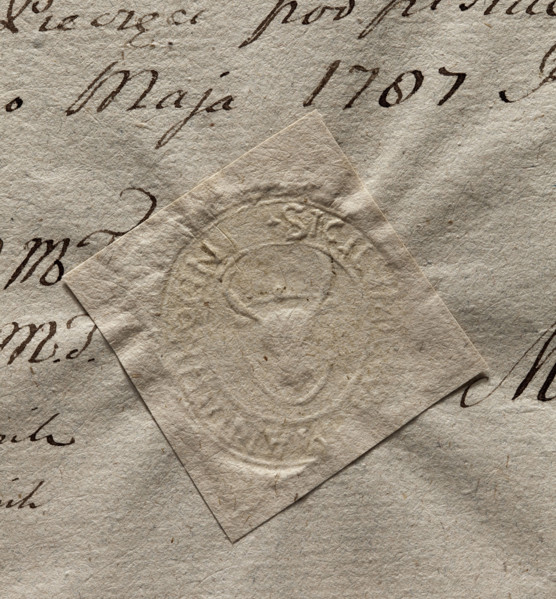 Oval impression of the seal of the town of Tykocin. On the shield there is a bison's head with