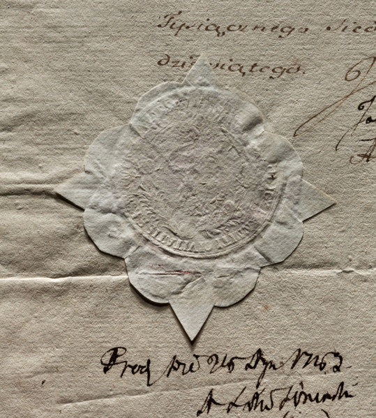 Round impression of the seal of the City of Warsaw. The drawing in the palm branch cartouche is