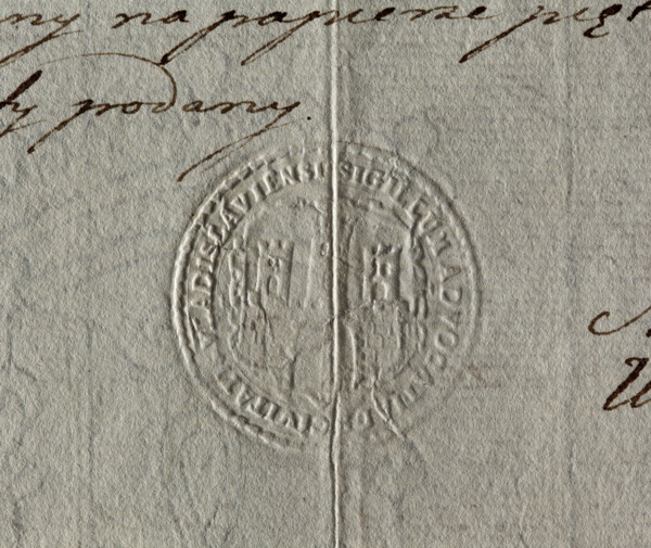 Round impression of the city seal of Wloclawek. City wall with an open gate, battlements and three