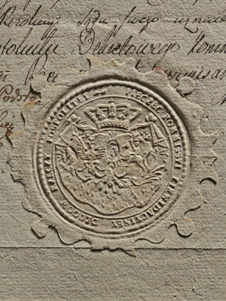 Round imprint of the seal of the Debt Liquidation Commission of the Republic of Poland. On the
