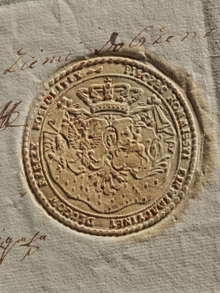 Round seal of the Debt Liquidation Commission of the Republic of Poland. On the ermine cloak, under