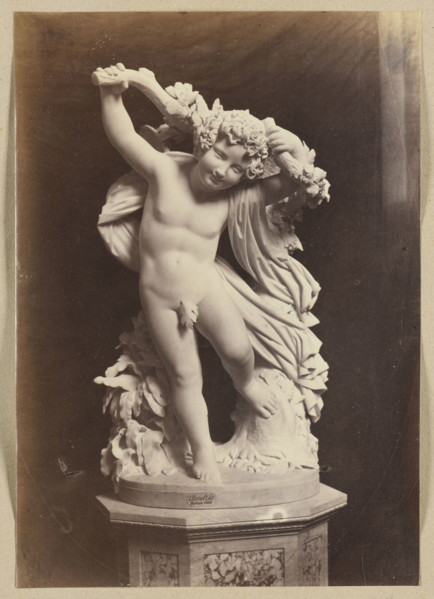 Photograph of a sculpture by Wiktor Brodzki from ca. 1868 depicting a putto with an ivy branch;