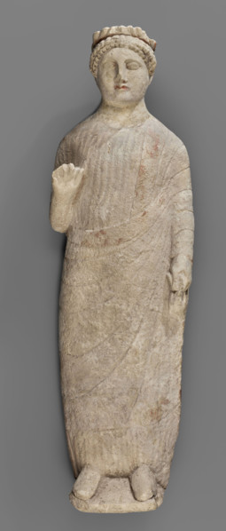 Votive figure of a youth holding a bird, votive offerings, Cypriot sculpture. Figurine of a youth