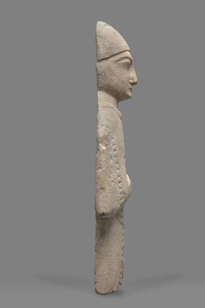 Fragment of a votive figure of a man. The fragment depicts a standing man dressed in a tutulus and