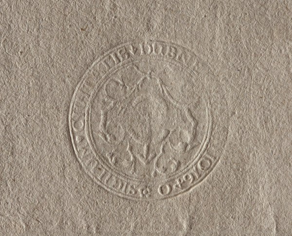 Round seal impression of the town of Dubno, Volhynian Voivodeship. Among stylized plants, the coat