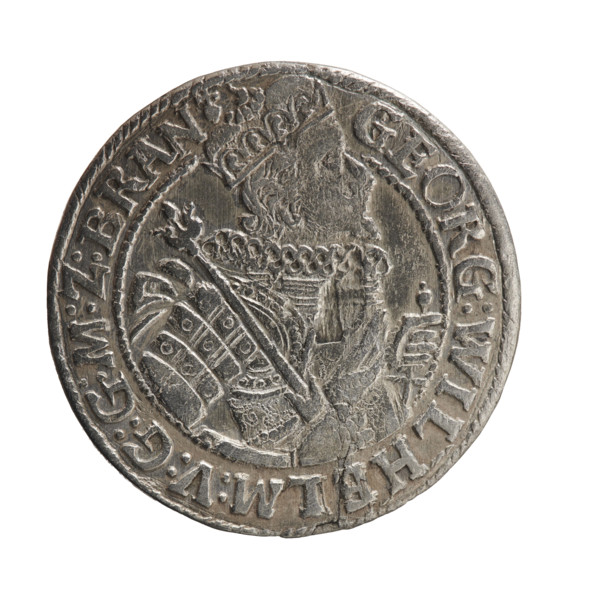 Obv. Bust facing right in a mitre, wide ruff and armor girded with a sash. A sceptre in his right