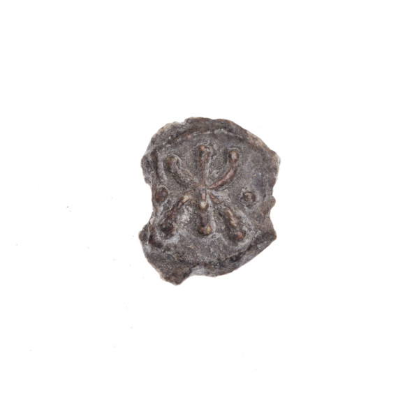 A fragment of a double-sided Drohiczyn seal. On one side, a bident with a crossed-out right arm. On