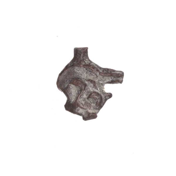 Fragment of a double-sided Drohiczyn seal. On one side, probably a two-pronged shape is visible; on