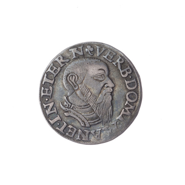 Male bust in armour turned right, with a beard and sideburns; rim with pearl border and inscription