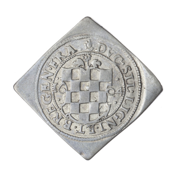 3 kreuzer coin, 1604. Obverse: eagle under a ducal mitre dividing the rim; on his chest within a