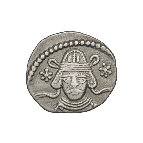 Drachma of Vardanes II (55–58 CE). Obverse: frontal head of Vardanes II with two stars at the