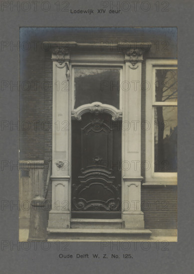 Oude Delft WZ No. 125. Louis XIV door, Door of a building on the Oude Delft in Delft, photograph,
