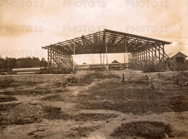 Construction of a shed, photograph, Framework of a shed under construction. Part of the group of