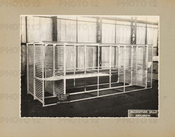 Paint lamination racks, album page, photograph, Album page with a photo of 'fixed paint lamination