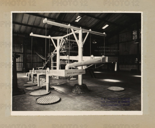 Installation, album page, photograph, Album page with a photo of an installation with conveyor