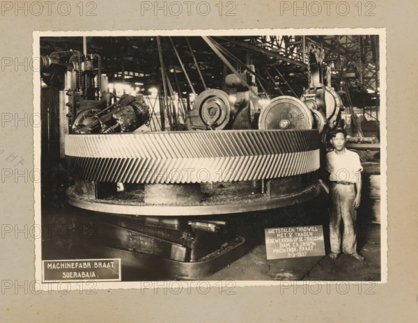 Gear, album page, photograph, Album page with a photo of a cast steel gear being worked on the