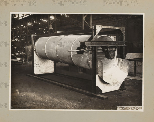 Drum, album page, photograph, Album page with a photo of a drum for a machine. Part of a photo