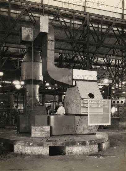 Fermentation machine, album page, photograph, A fermentation machine standing in a factory hall,