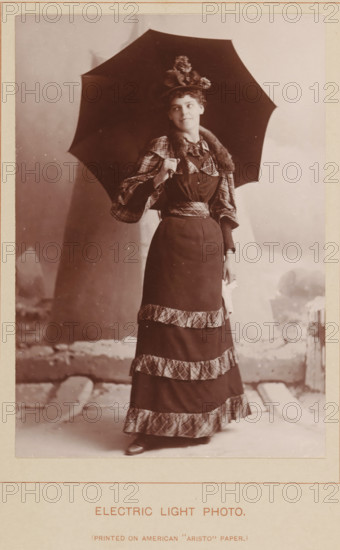 Electric Light Photo, Portrait of an unknown woman with an umbrella, photograph, page, inscription: