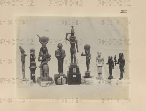 Nine Egyptian objects, including bronze sculptures of Mut, Anupt, Isis with Horis and Apis,