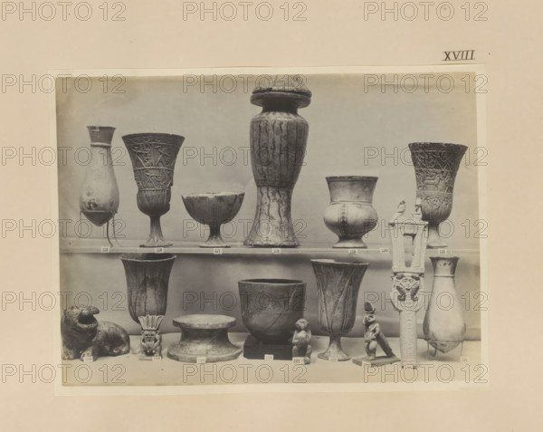 Sixteen Egyptian objects, vases, a sculpture of Bes and a sistrum, photograph, page, number: