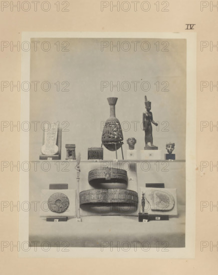 Twelve Egyptian objects, including a bronze sculpture of Neith, two gold bracelets and a gold