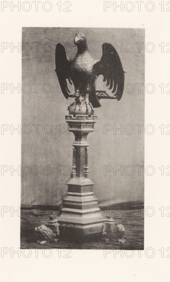Sculpture of an eagle on a pedestal from the Basilica of Saint Martin in Halle, displayed at an