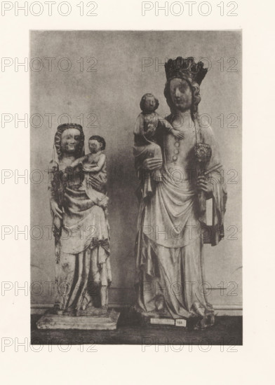 Sculpture of alabaster and a sculpture of marble of Mary with child, displayed at an exhibition of