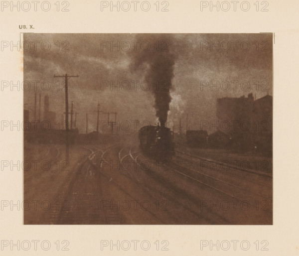 Railway lines with steam train, page, photomechanical print, inscription: 'The hand of man by