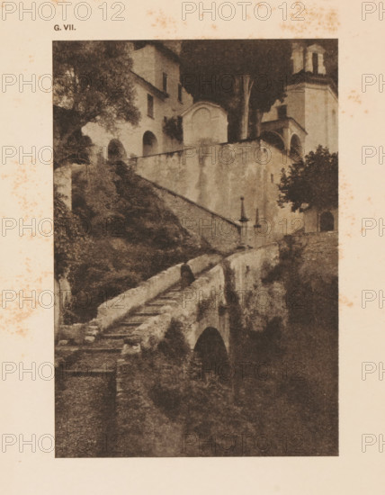 Cityscape in the mountains, page, photomechanical print, inscription: 'Romantic Landscape by Dr. H.
