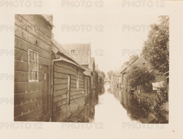 Houses along a ditch in Zaandam, page, photomechanical print, title: 'Afternoon in Zaandam.',