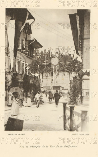 Arc de triomphe de la Rue de la Préfecture, View of a street with an arch of honor in Fribourg,
