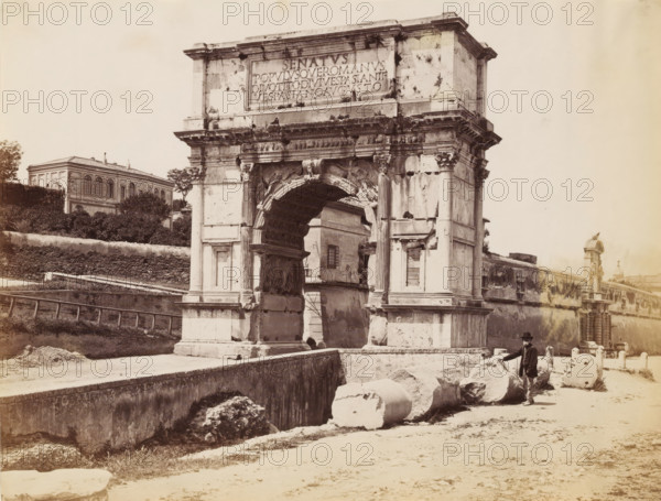 Man posing by the Arch of Titus at the Roman Forum in Rome, photograph, Part of a French artist's