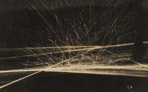 Barrage with machine gun(s) at evening or night, photograph, number: '54', name: 'PHOTO WIDMER,