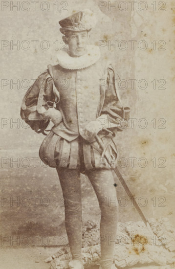 Portrait of a young man in costume, identified as HM Hijmans, album page, photograph,