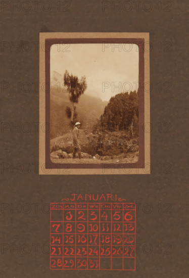 Bound calendar and three loose calendar pages from 1923 with photos of a traveling couple and