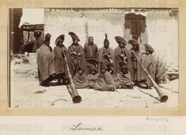 Group of Tibetan lamas with wind instruments (dunchen), Tibet, photograph, Part of Photo album with