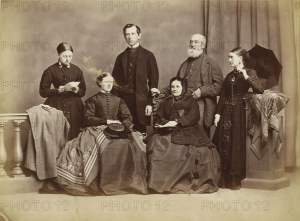 Group portrait of a family in a photo studio, possibly in Norway, photograph, Part of an English