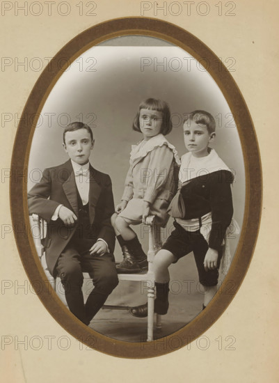 Group portrait of two boys and a young girl, album page, photograph, cabinet photograph, This photo