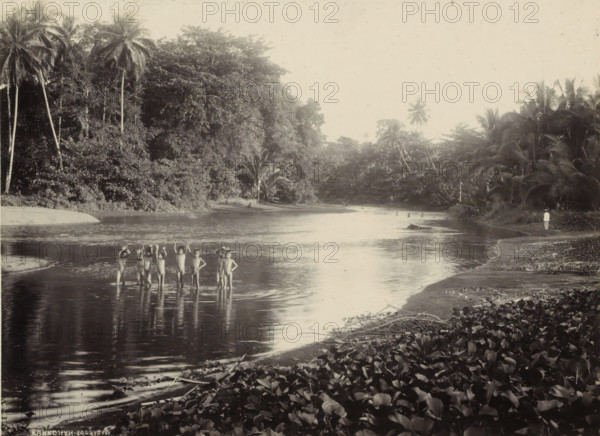 Children bathing in a body of water in the Dutch East Indies, photograph, Part of a travel album