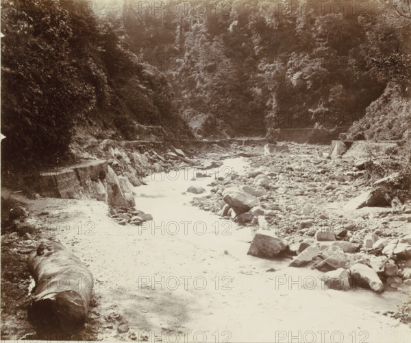 Stream bed with a road in the Dutch East Indies, album page, photograph, Part of Album with photos