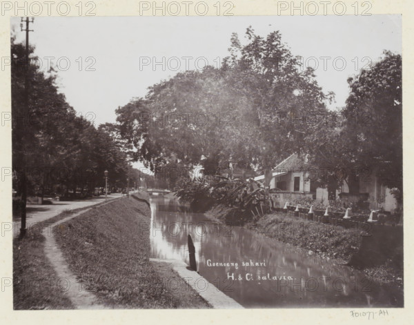View of a house and the water of Gunung Sahari in Batavia, Goenoeng sahari., album page,