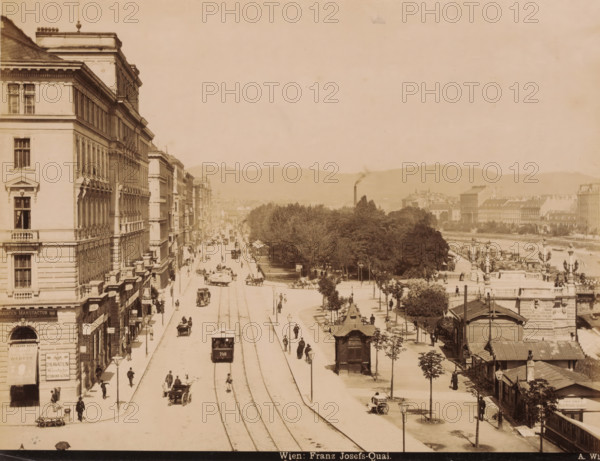View of the Franz Josefs-Quai. in Vienna with shops, buildings, trams and carts, Wien. Franz