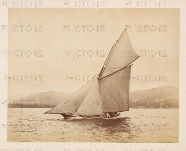 Sailing ship Idalia No. 1 launched with a hilly landscape in the background, album page,