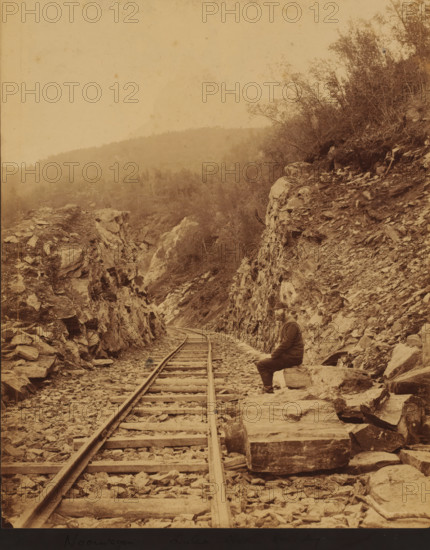 View of the Luleå - Narvik railway line, on the right an unknown man along the track, Norway, Lulea