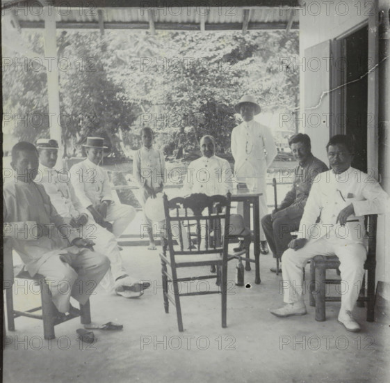 Manoekwari, Seven men and a child on a veranda in Manokwari, West Papua, stereograph, Manokwari,