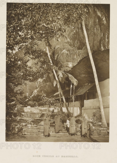 Exterior of the Dambulla Cave Temple, Sri Lanka, page, photomechanical print, Four monks stand in