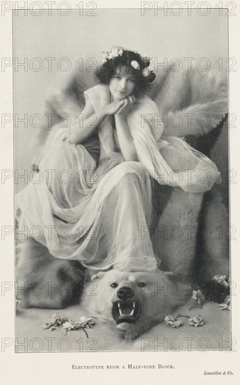 Portrait of an unknown woman on a polar bear skin, page, photomechanical print, printmaker:
