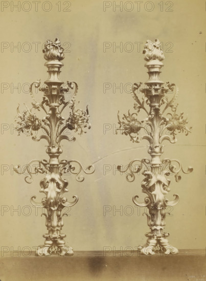 Two candlesticks decorated with leaf motifs and a flame, photograph, page, name: 'Witz & cie Phot.